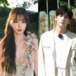 Two people standing outdoors near a fence.