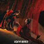 Two people in dramatic red and black.