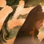 Period drama couple gazing at each other.