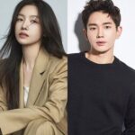 Two people posing in stylish outfits.