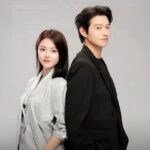 Smiling couple standing back to back.