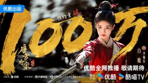 Woman in traditional attire holding a sword.