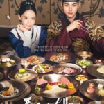 Historical drama characters with traditional Korean feast.
