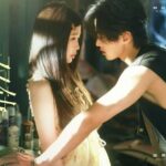 Man and woman in a romantic scene.