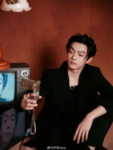 Person taking selfie with vintage TV.