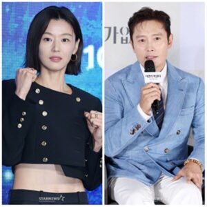 Two people posing at a public event.