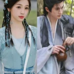 Two people in traditional Chinese clothing.